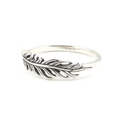 A sterling silver feather ring with an oxidized dark finish in the recessed details, shown on a plain white background.