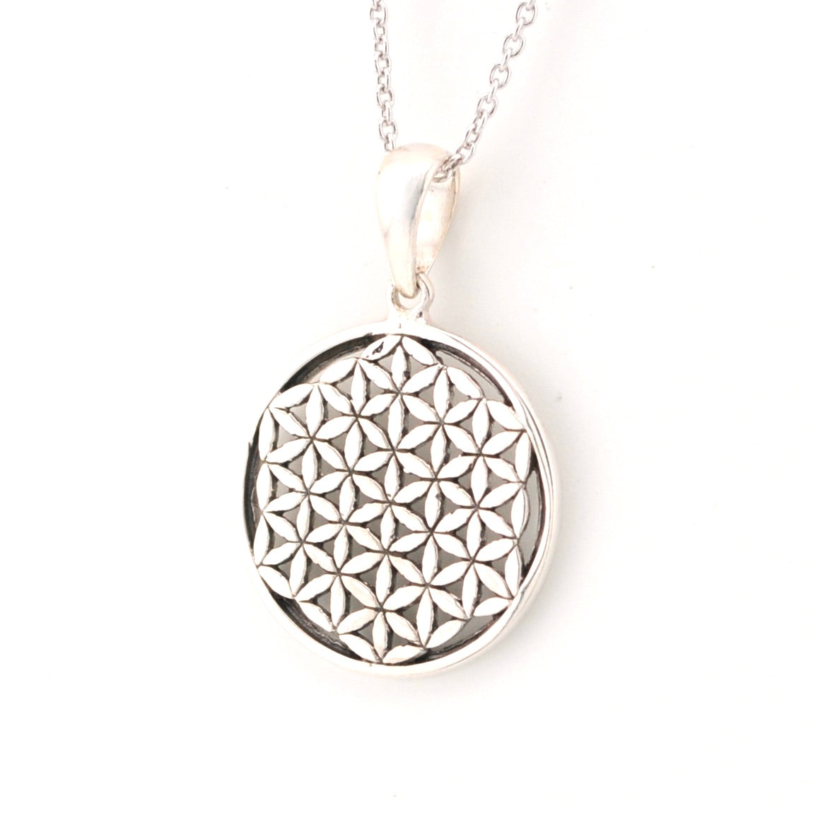 Silver necklace with a round pendant featuring a geometric pattern on a white background
