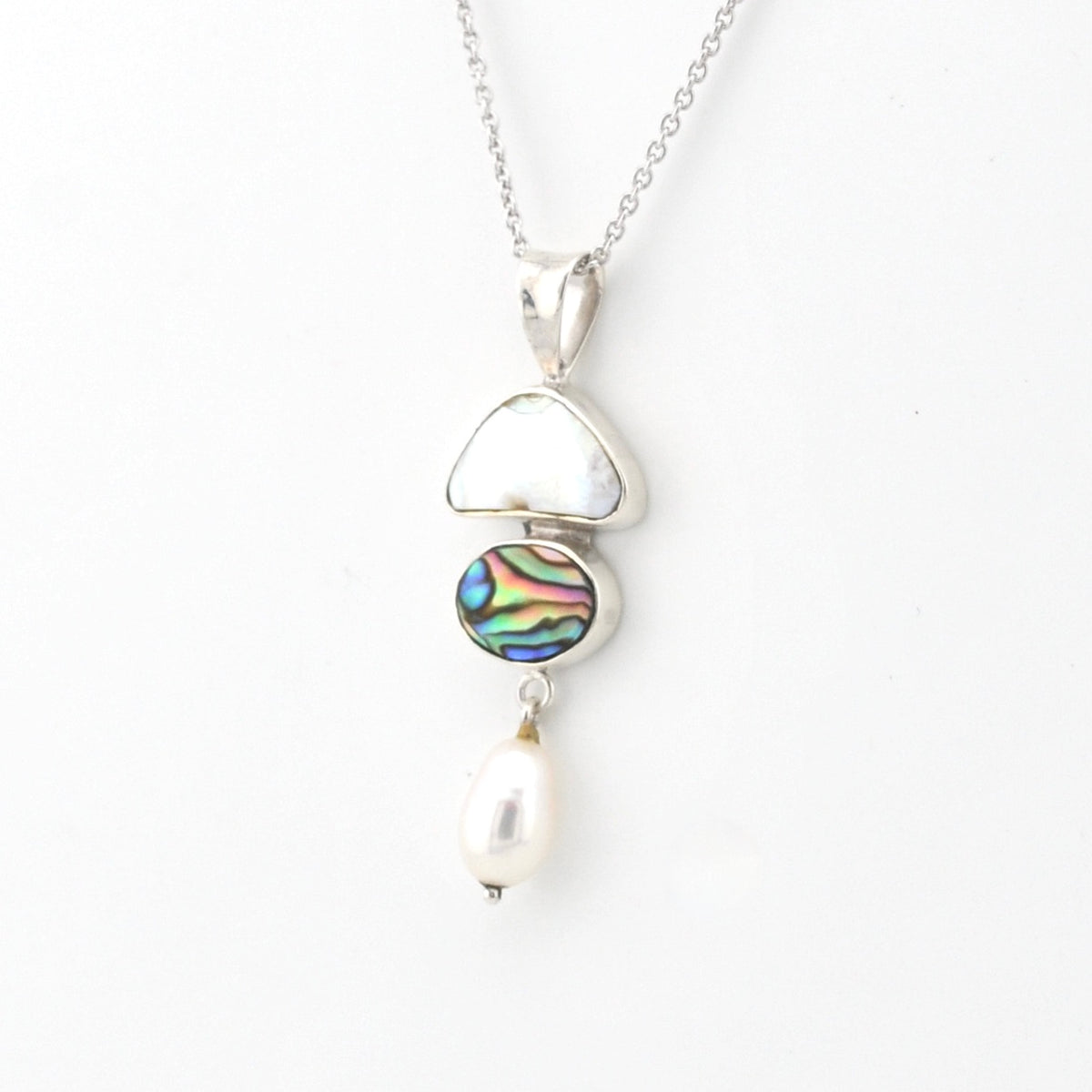 Necklace with a pendant featuring a colorful gemstone and pearl on a white background