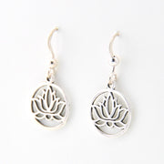 Silver lotus flower earrings on a white background