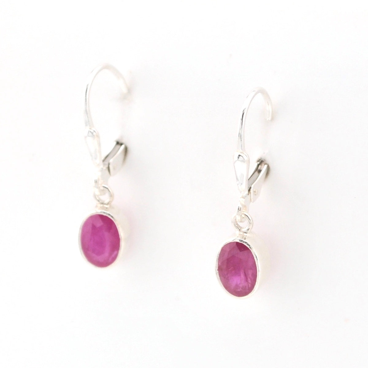 Side View Silver Ruby 5x7mm Oval Dangle Earrings
