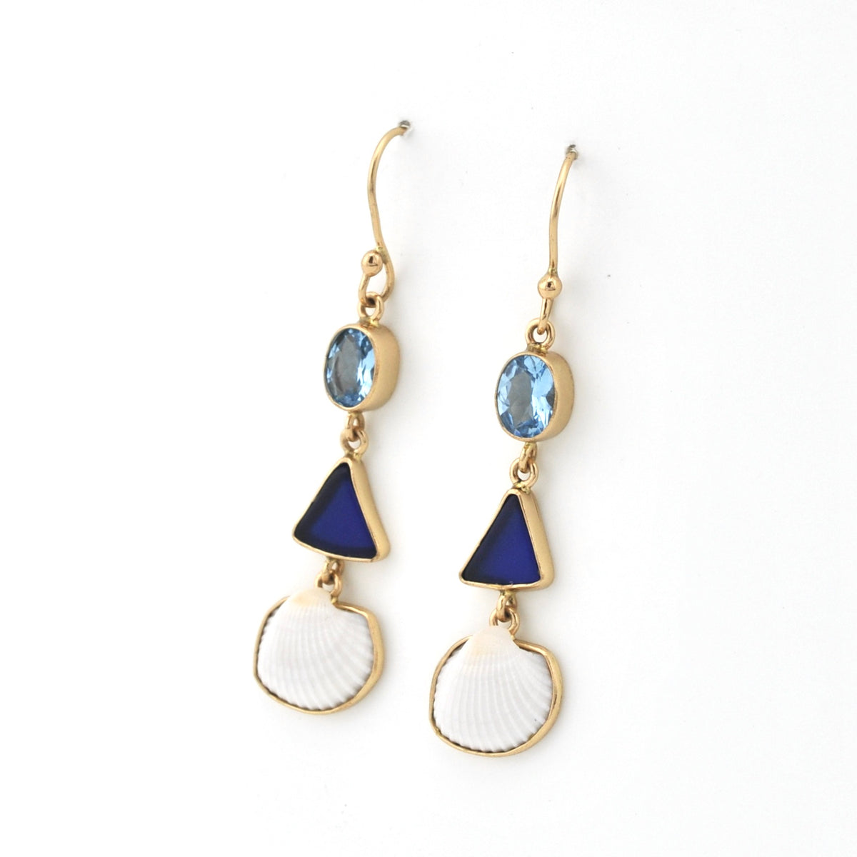 Gold earrings with blue and white stones on a white background
