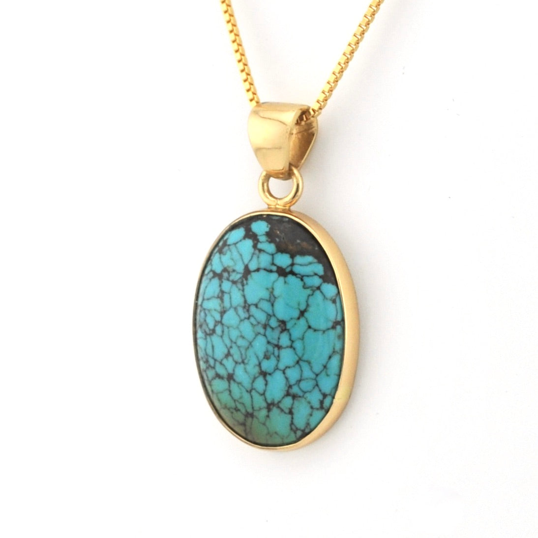 Turquoise pendant necklace on a white background