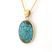 Turquoise pendant necklace on a white background