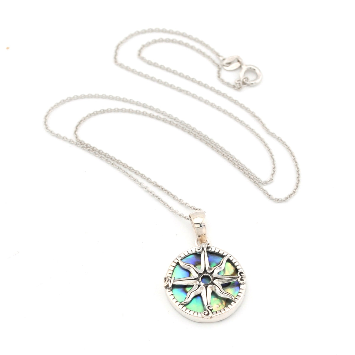 Silver necklace with a colorful pendant on a white background