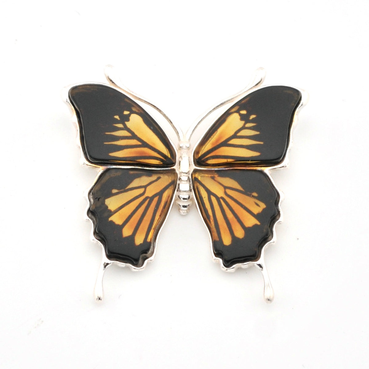 Butterfly-shaped pendant with black and gold wings on a white background