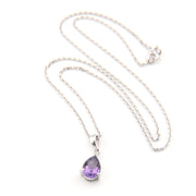 Necklace with a purple teardrop pendant on a white background