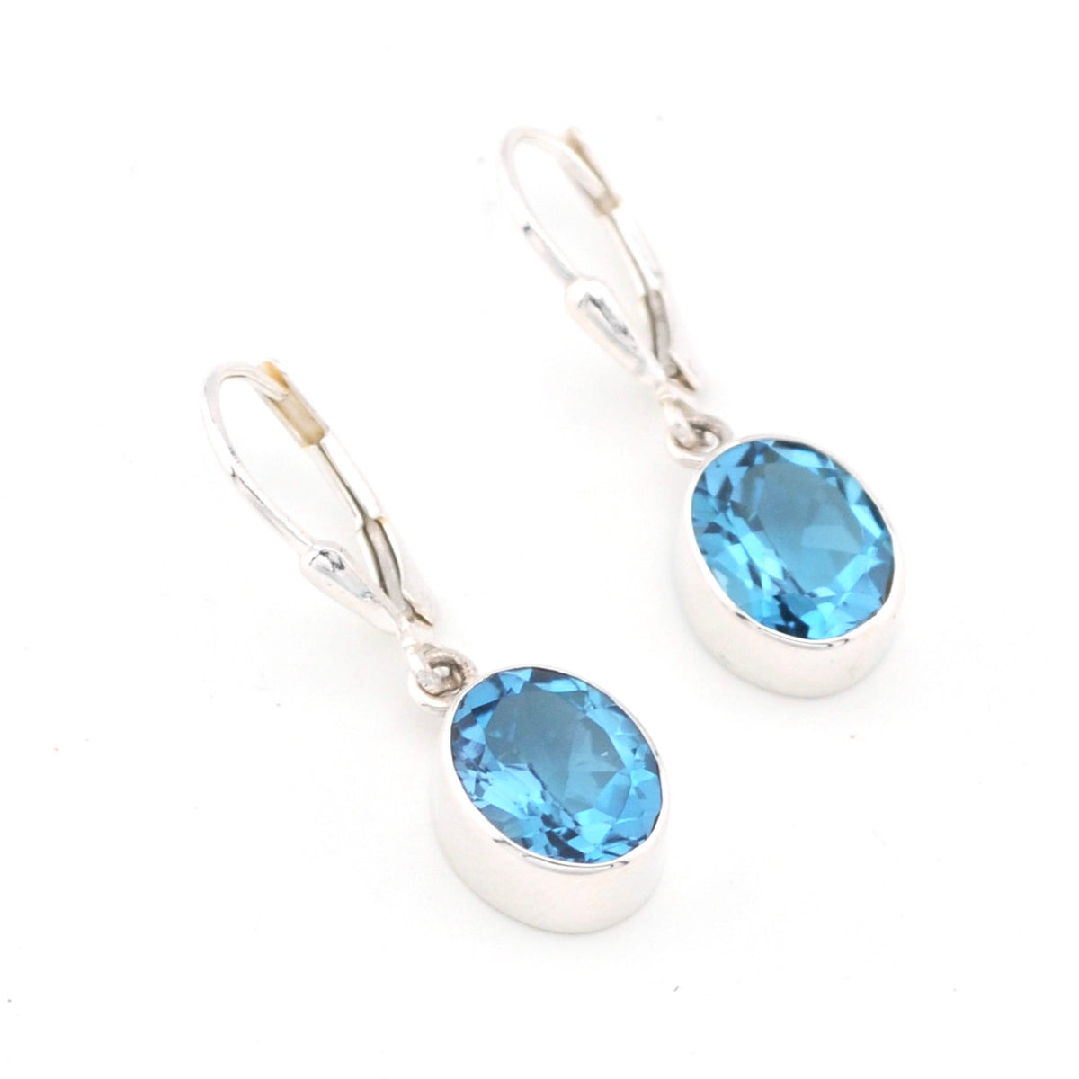 Silver Blue Topaz 8x10mm Oval Dangle Earrings