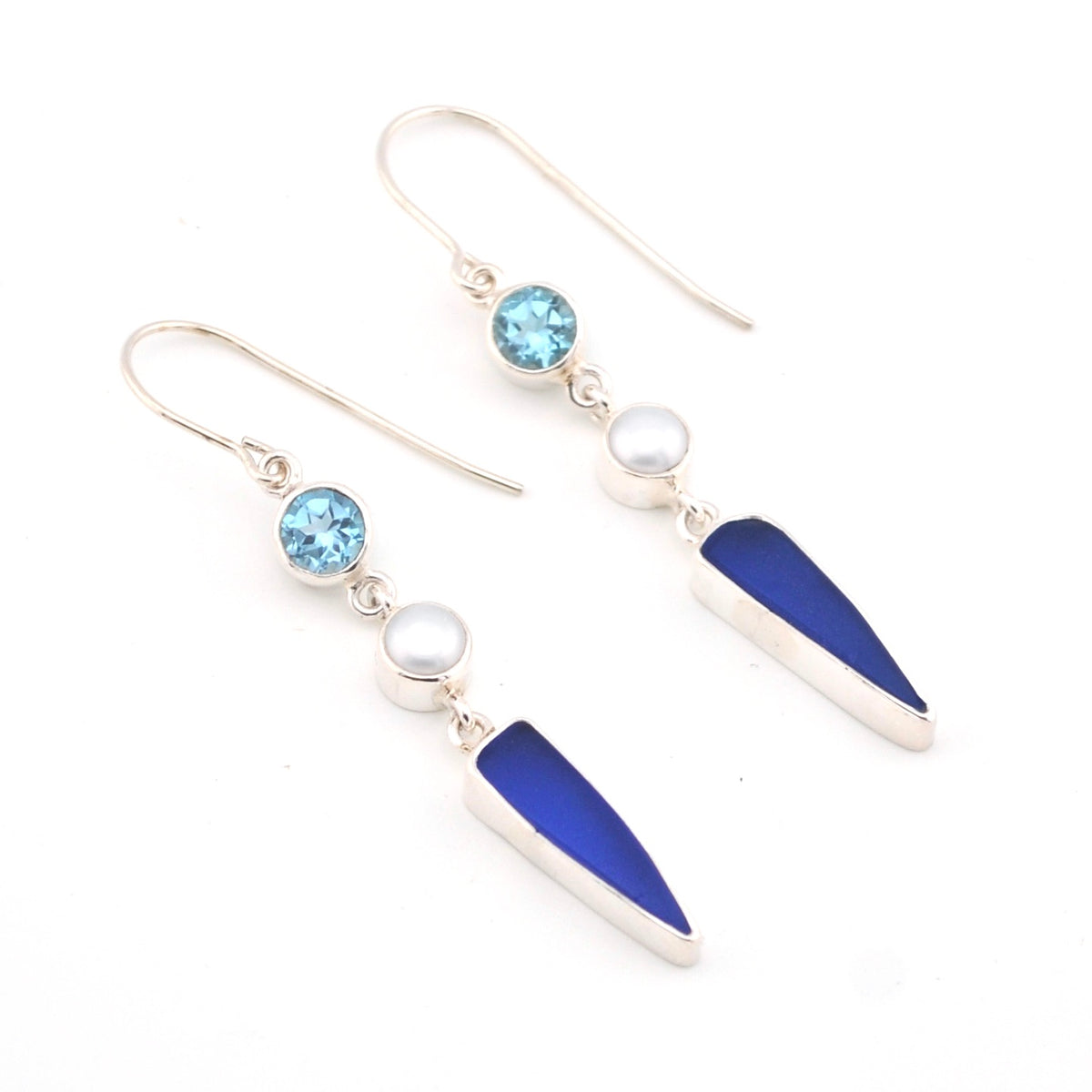 Earrings with blue and white elements on a white background