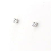 Pair of silver stud earrings with clear gemstones on a white background