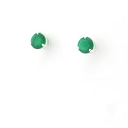 Pair of green stud earrings on a white background