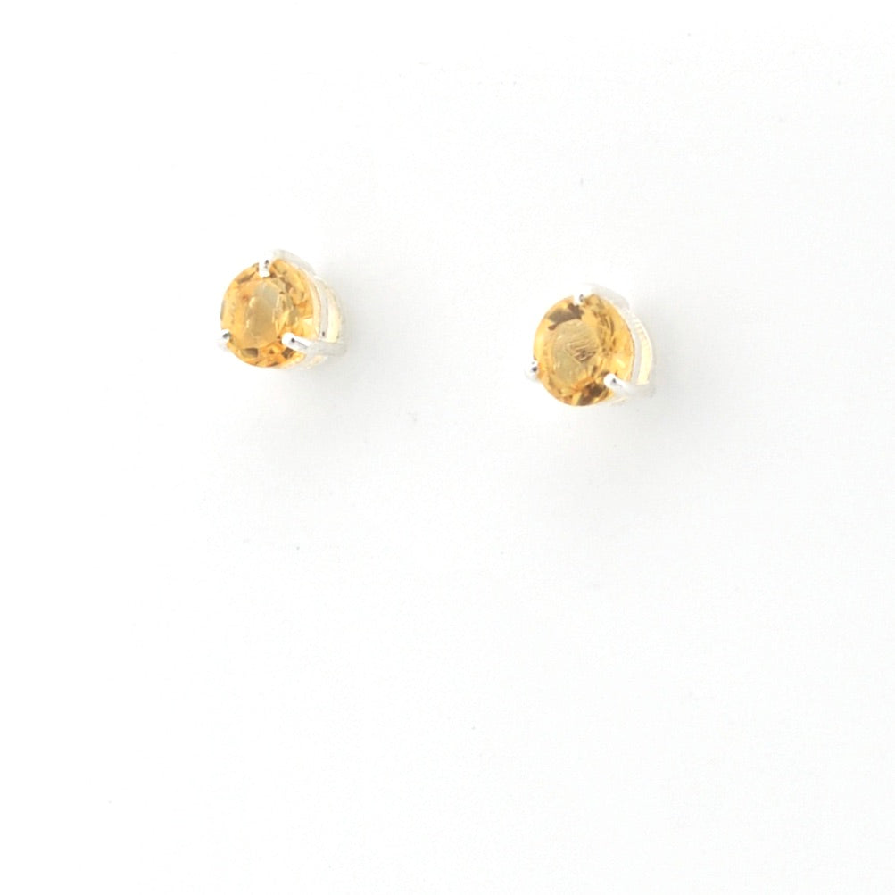 Pair of citrine earrings on a white background