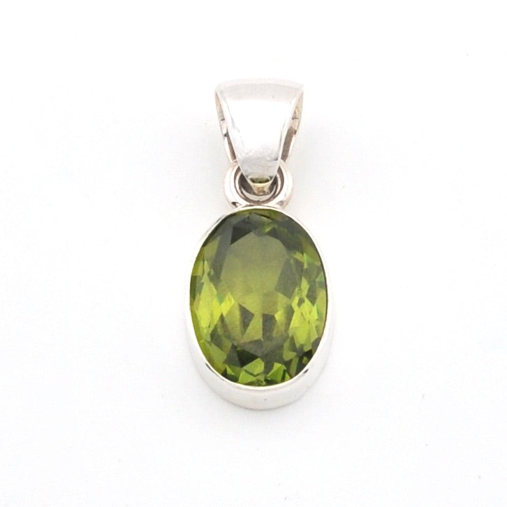 Green gemstone pendant on a white background