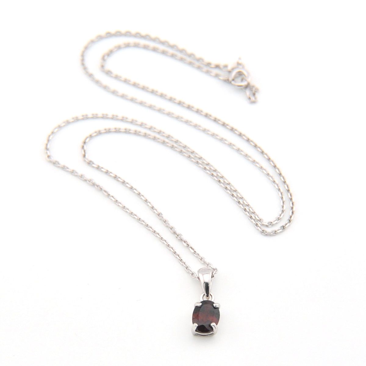 Silver necklace with a pendant on a white background