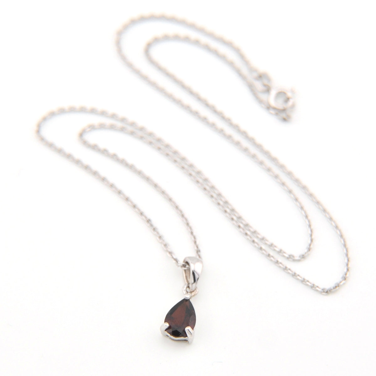 Necklace with a teardrop-shaped pendant on a white background