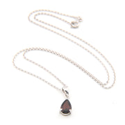 Necklace with a teardrop-shaped pendant on a white background