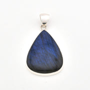 Teardrop-shaped blue pendant on a white background