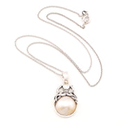 Silver pearl pendant with octopus on white background