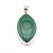 Green malachite pendant with silver setting on a white background