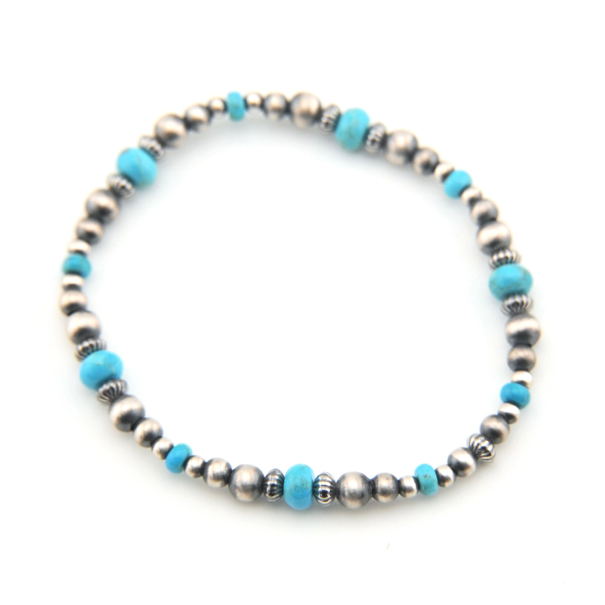 Beaded bracelet with blue and silver beads on a white background