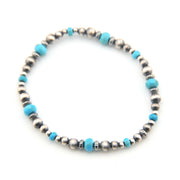 Beaded bracelet with blue and silver beads on a white background