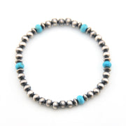 Beaded bracelet with silver and turquoise beads on a white background