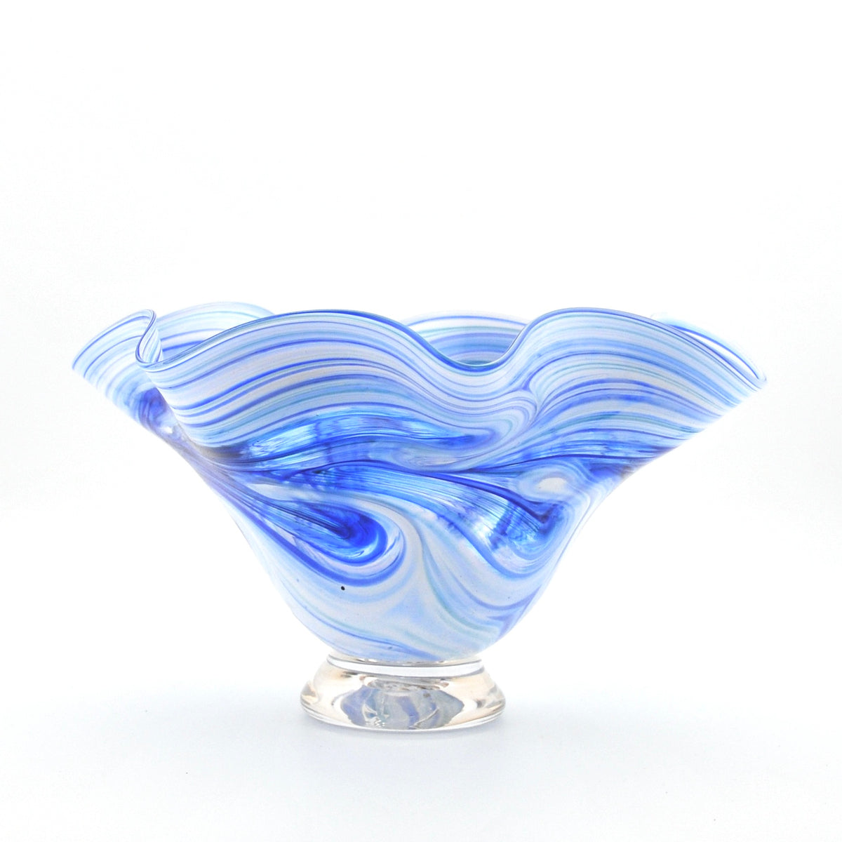 Blue and white glass bowl with wavy design on a white background
