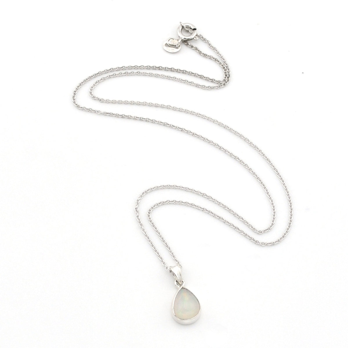 A silver chain necklace with a teardrop-shaped white opal pendant, displayed on a clean white background.