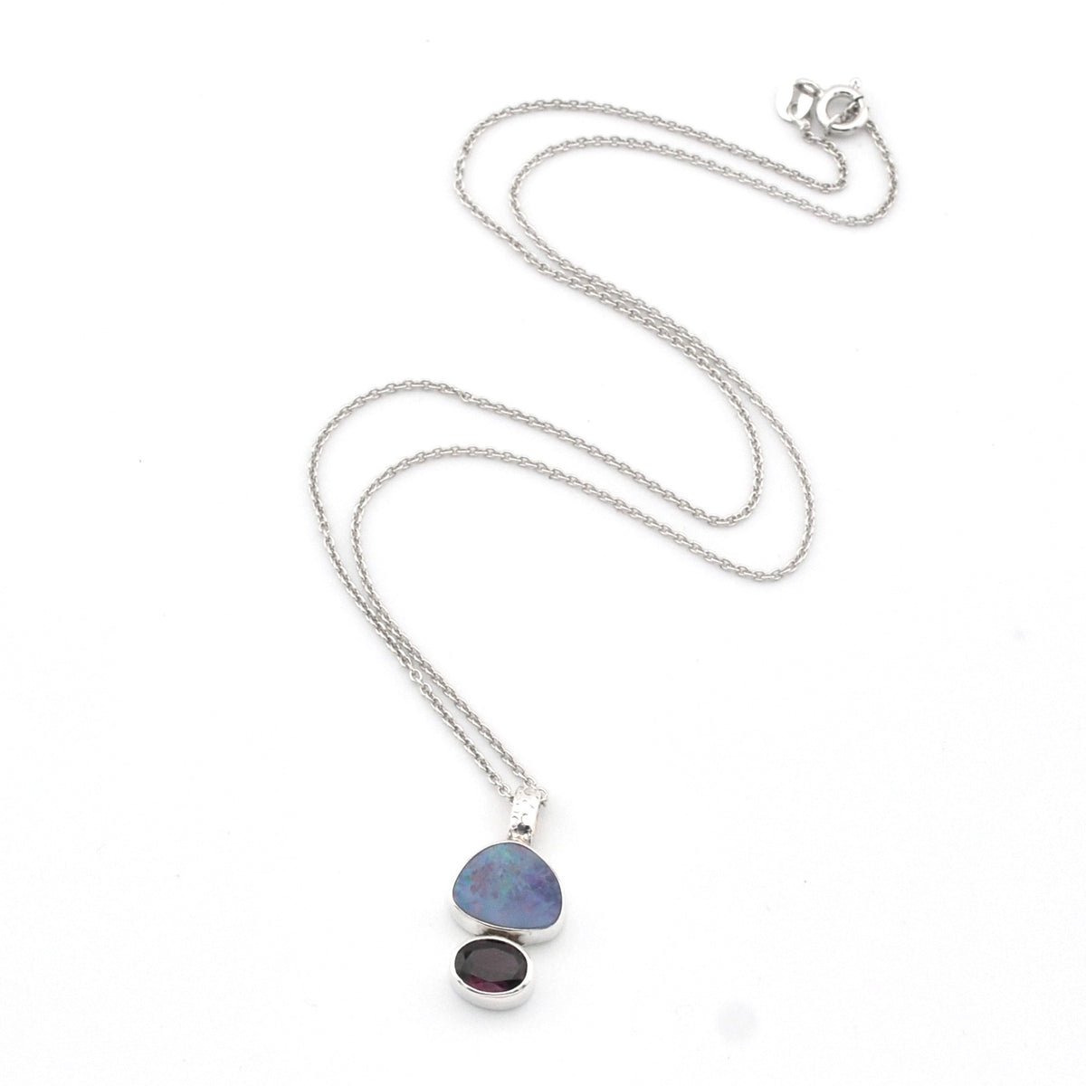 Necklace with a pendant featuring two stones on a white background