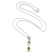 Silver necklace with a 2 green peridot stone pendant on a white background