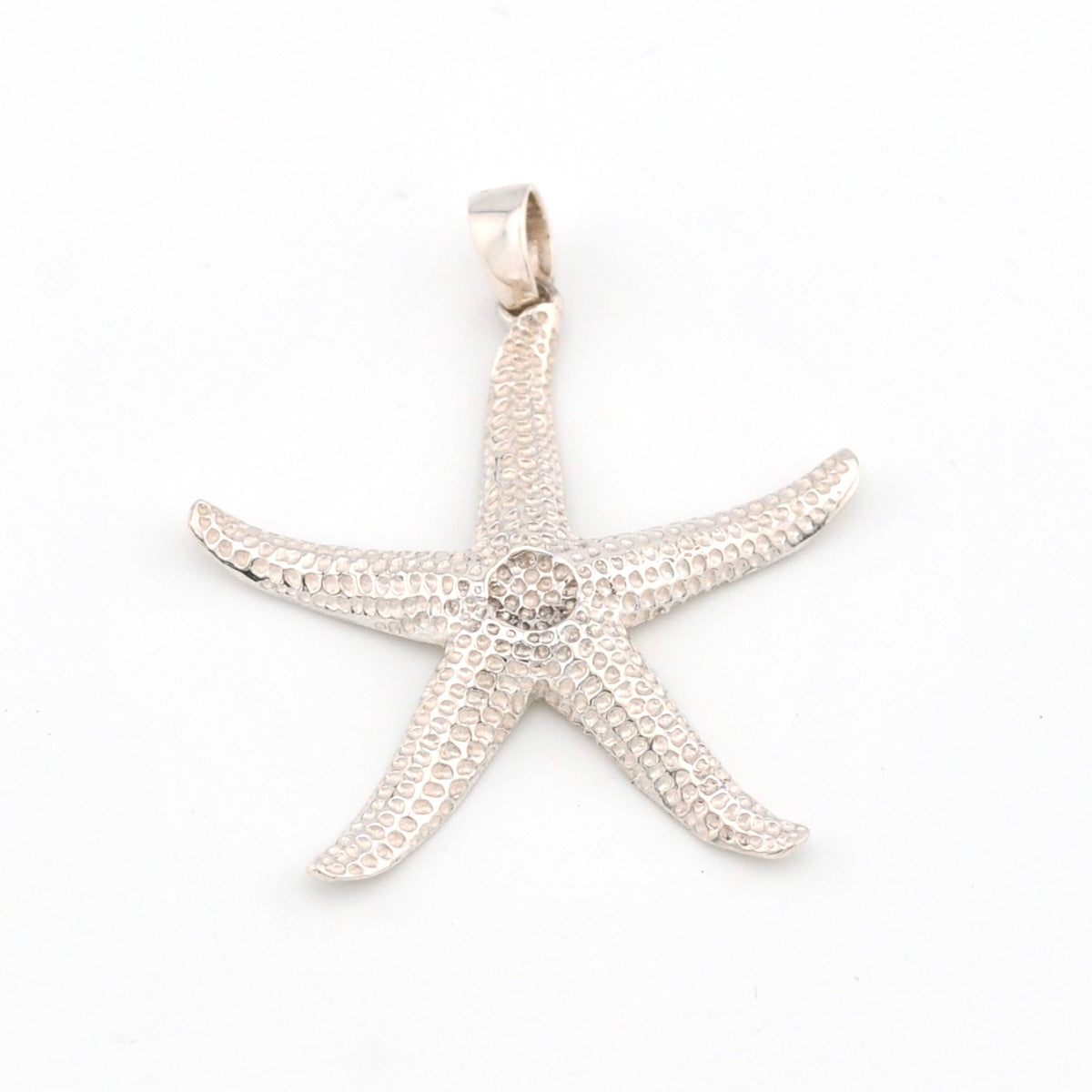 Silver starfish pendant on a white background