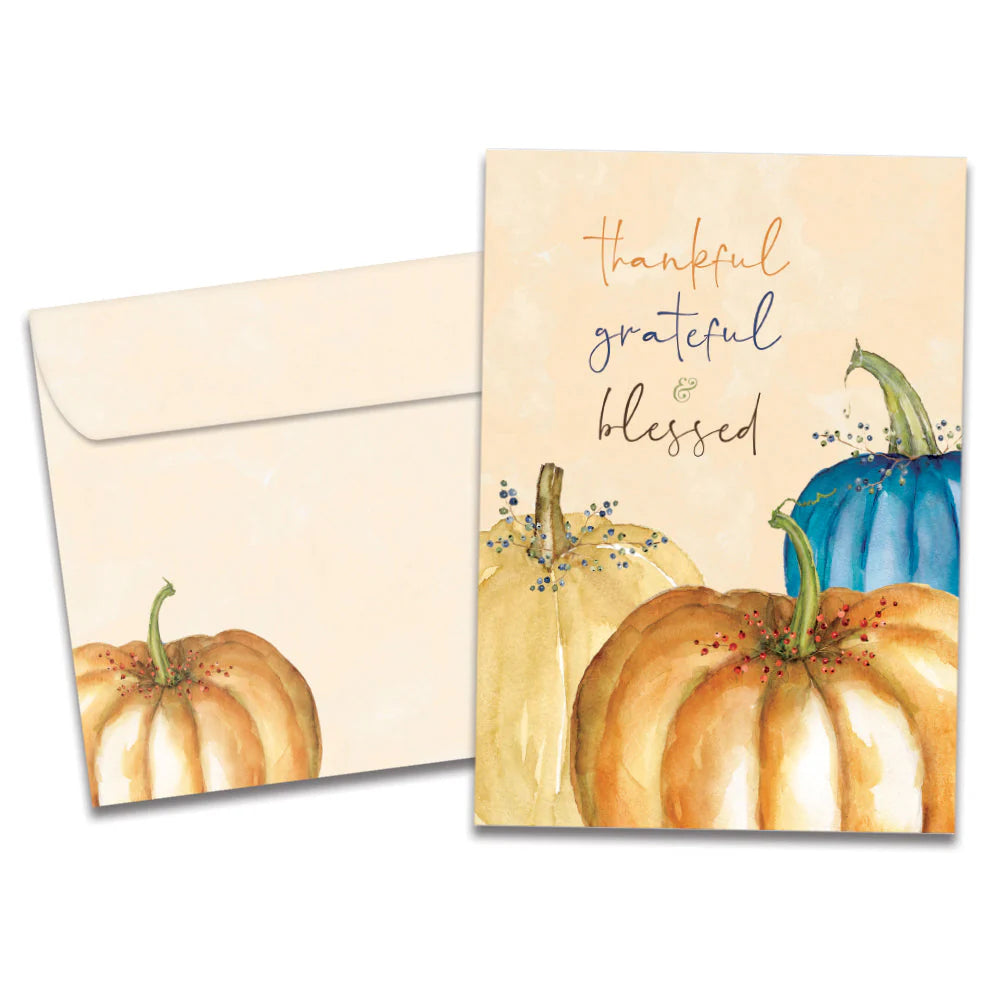 Greeting card with pumpkins and 'thankful, grateful & blessed' text on a white background