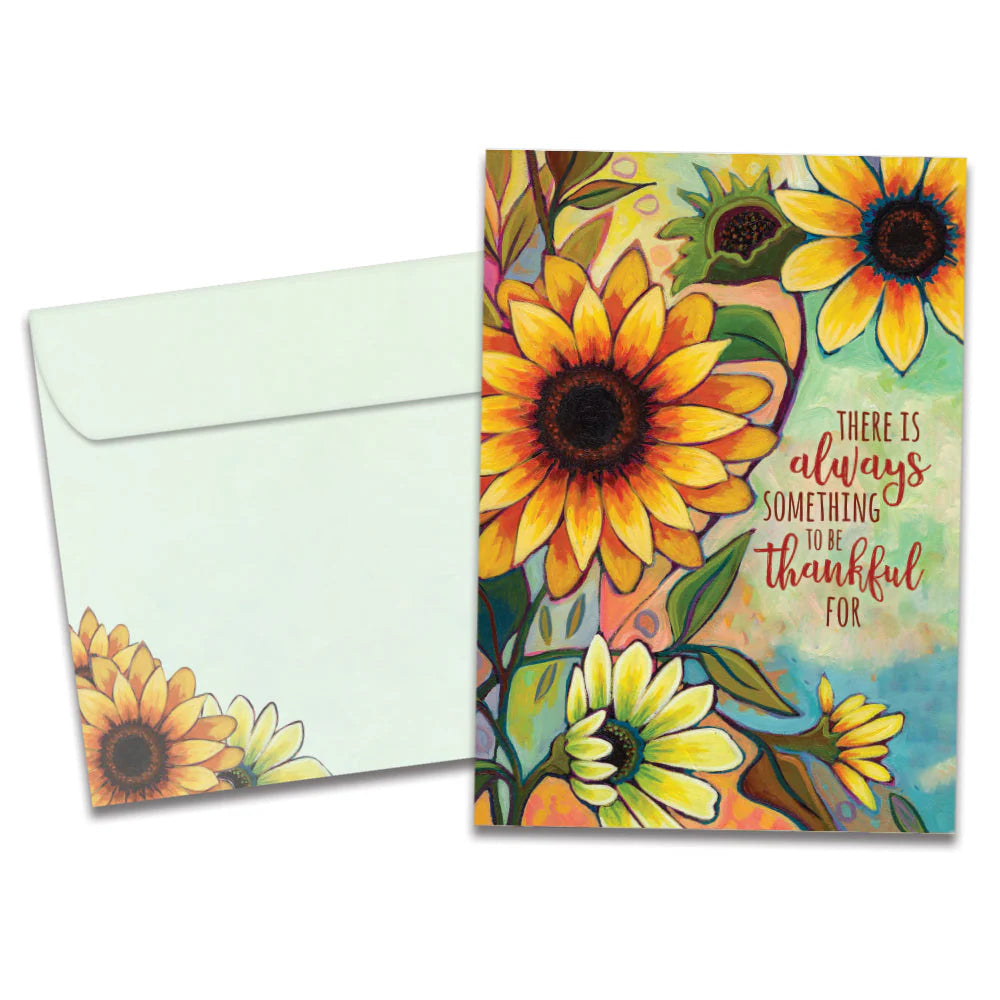 Greeting card with sunflower design and motivational quote, featuring a matching envelope.