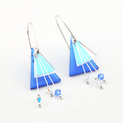 Blue and white geometric earrings on a white background