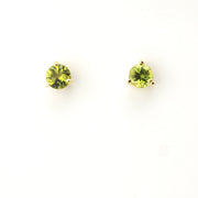 Pair of green gemstone stud earrings on a white background