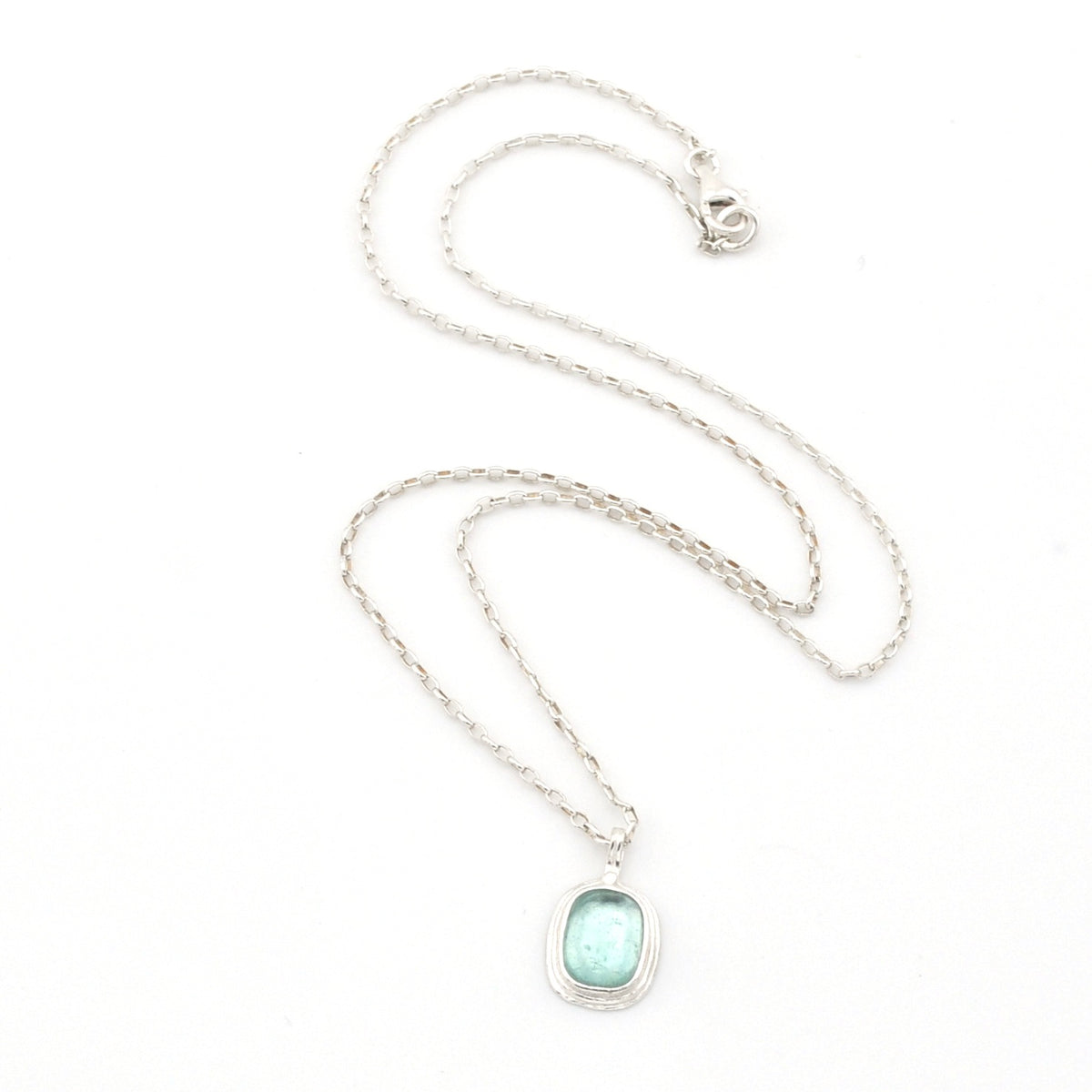 Necklace with a light blue pendant on a white background