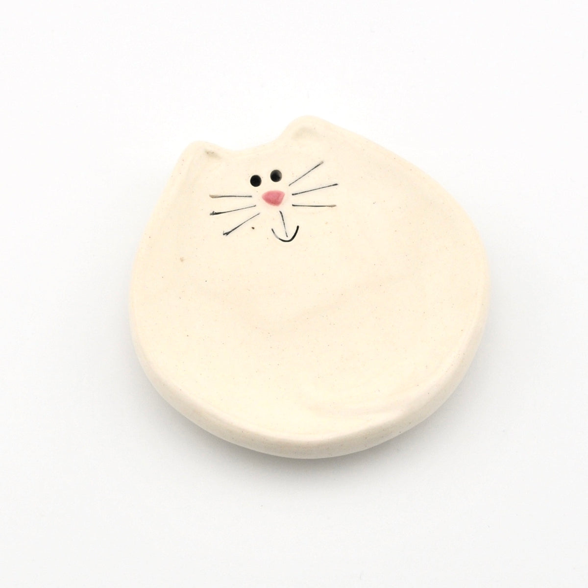 Dish with a cat face on a white background