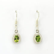 Alt View Sterling Silver Peridot 5x7mm Oval Dangle Earrings