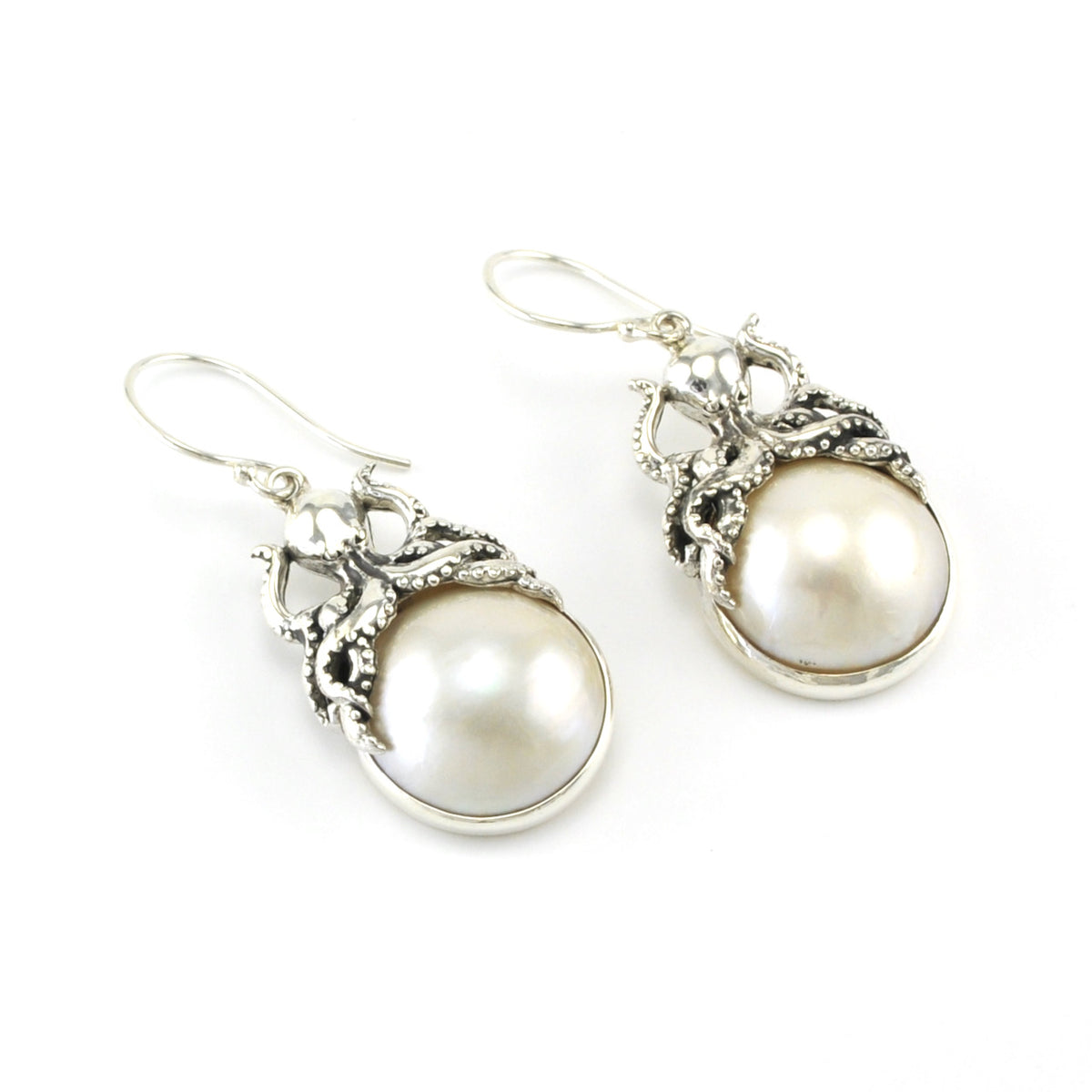 Side View Silver Octopus Sitting on Mabé Pearl  Earrings